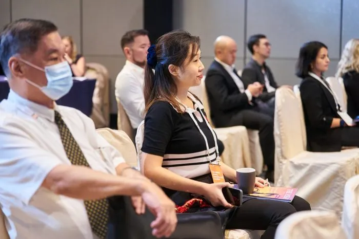 Attendees listening to a mining investment presentation at 121 Hong Kong